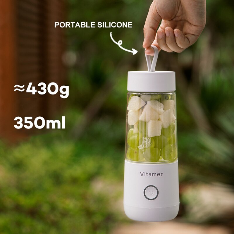 Vitamer rechargeable personal blender with portable silicone handle holding fresh fruit in a 350ml jar