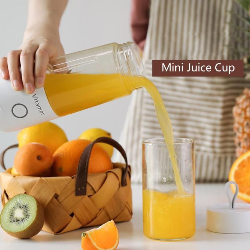 Vitamer rechargeable personal blender pouring fresh orange juice into a glass with fruit basket background