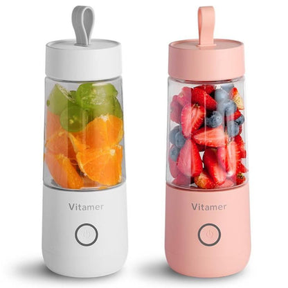Vitamer rechargeable personal blender in white and pink with fresh fruits inside for smoothies